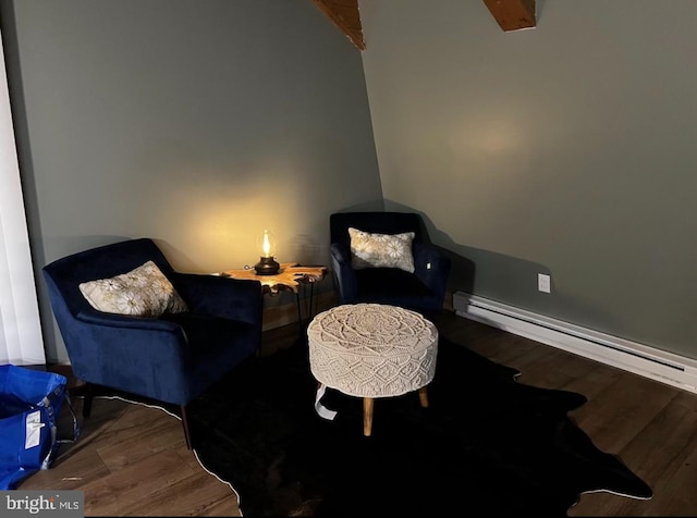 sitting room featuring hardwood / wood-style floors and a baseboard radiator