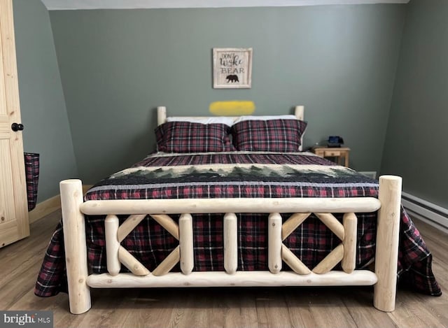 bedroom with hardwood / wood-style flooring