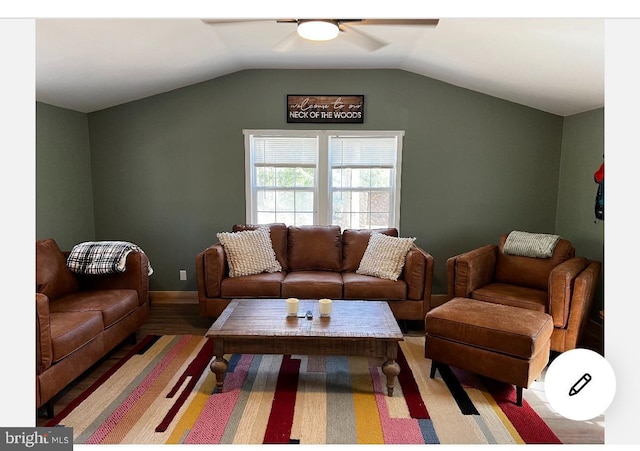 living room featuring hardwood / wood-style flooring, ceiling fan, and lofted ceiling