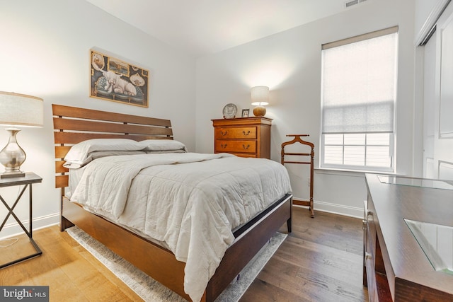 bedroom featuring a closet and hardwood / wood-style floors