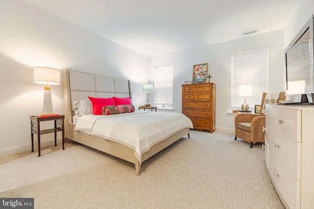 bedroom featuring light colored carpet