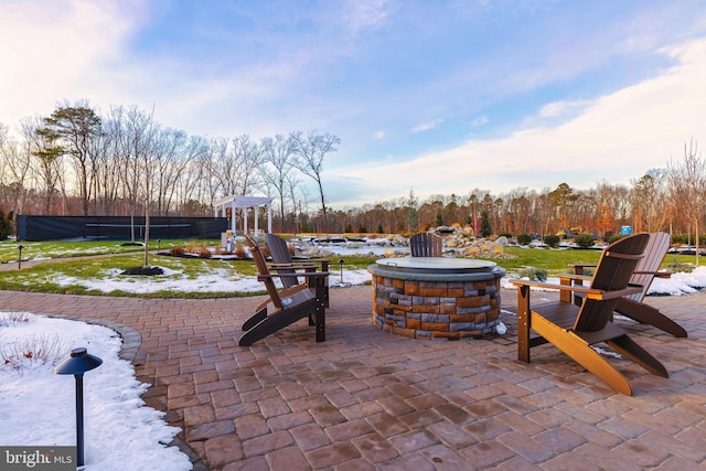 view of patio featuring a fire pit