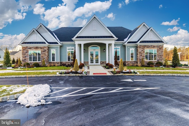 craftsman-style house with french doors