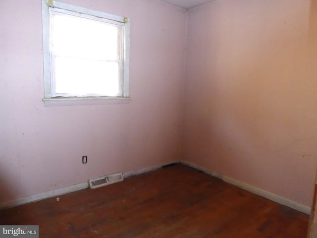 spare room with hardwood / wood-style flooring