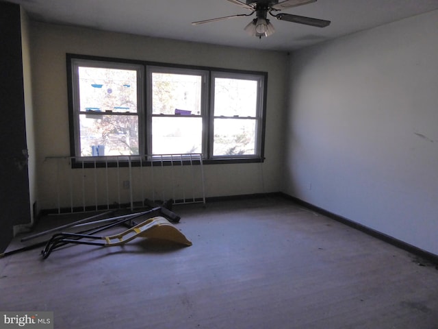 unfurnished room featuring ceiling fan and wood-type flooring