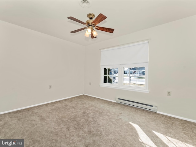 carpeted spare room featuring a baseboard radiator and ceiling fan