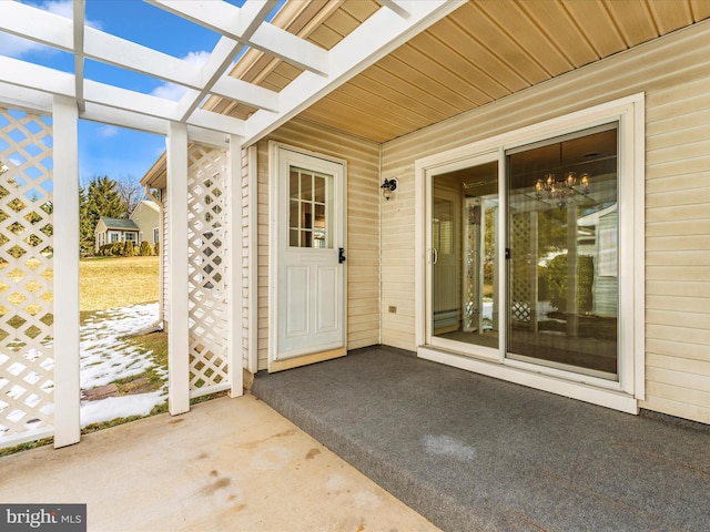 entrance to property featuring a patio