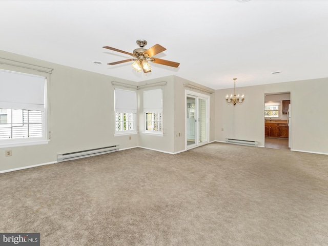 carpeted empty room featuring a baseboard radiator and ceiling fan with notable chandelier