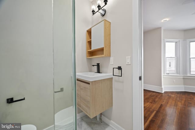 bathroom with vanity and an enclosed shower