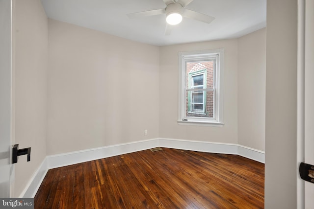 empty room featuring hardwood / wood-style flooring and ceiling fan