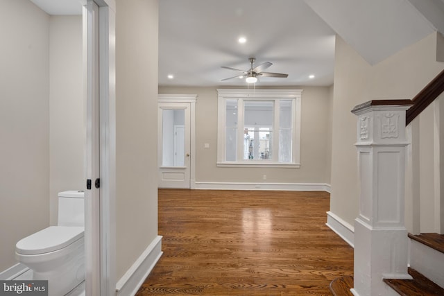 interior space featuring ceiling fan and dark hardwood / wood-style flooring