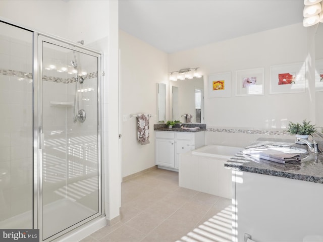 bathroom with tile patterned flooring, plus walk in shower, and vanity