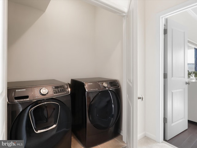 laundry area with washing machine and clothes dryer