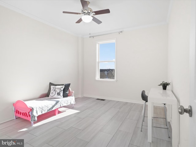 bedroom with ceiling fan and ornamental molding