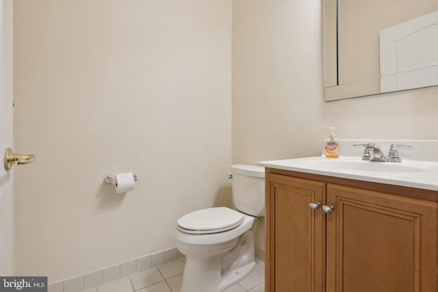 bathroom featuring toilet, vanity, and tile patterned floors