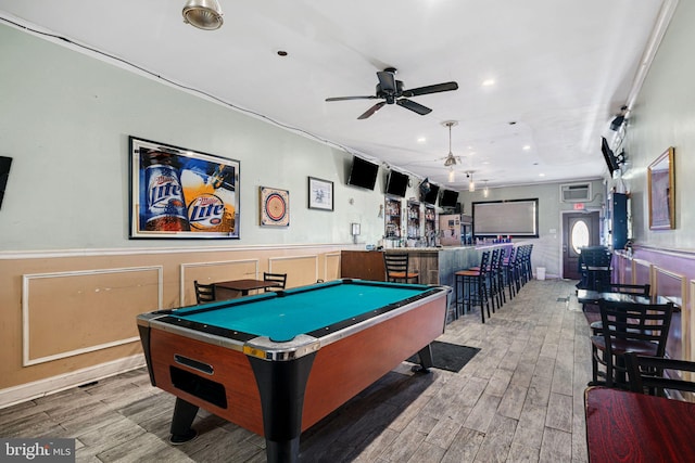 playroom featuring ceiling fan, pool table, and bar area