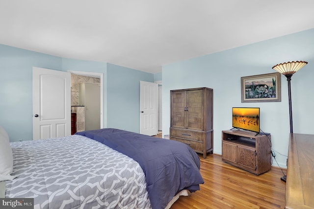 bedroom with light wood-type flooring