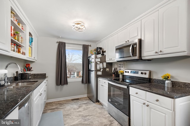 kitchen featuring sink, white cabinetry, and appliances with stainless steel finishes