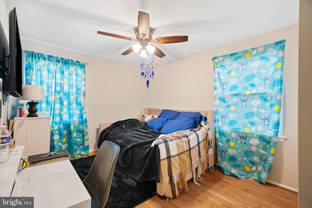 bedroom featuring ceiling fan and light hardwood / wood-style floors