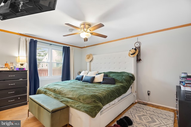 bedroom with ceiling fan, light hardwood / wood-style flooring, and ornamental molding