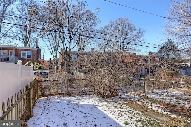 view of yard covered in snow