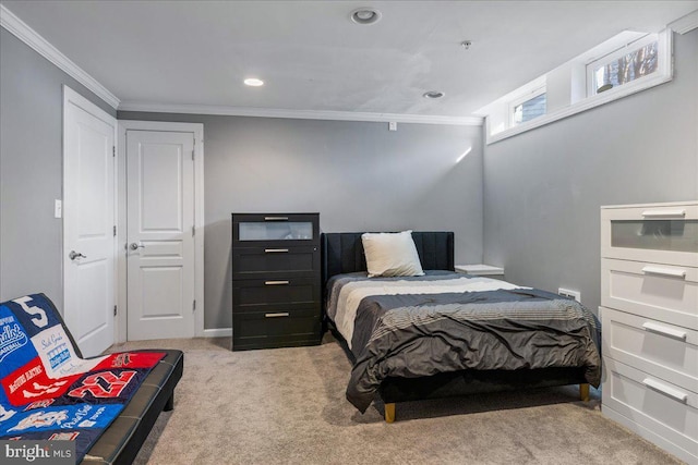 bedroom with ornamental molding and light carpet