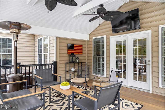 wooden deck featuring ceiling fan