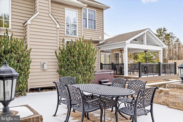 view of patio / terrace with a hot tub