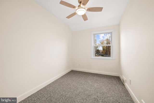 unfurnished room featuring ceiling fan, carpet floors, visible vents, baseboards, and vaulted ceiling