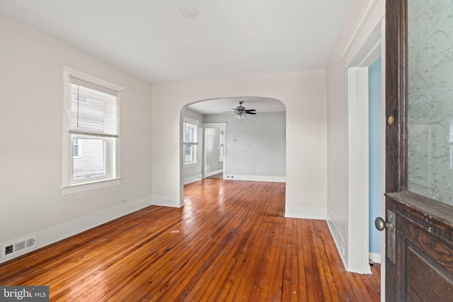 spare room with ceiling fan and hardwood / wood-style floors