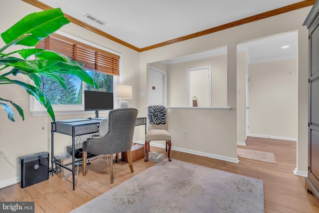 office space featuring ornamental molding and light wood-type flooring