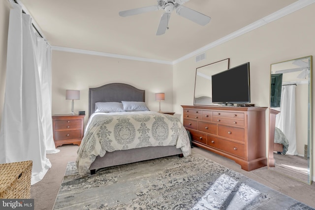 bedroom with ceiling fan, light colored carpet, and ornamental molding