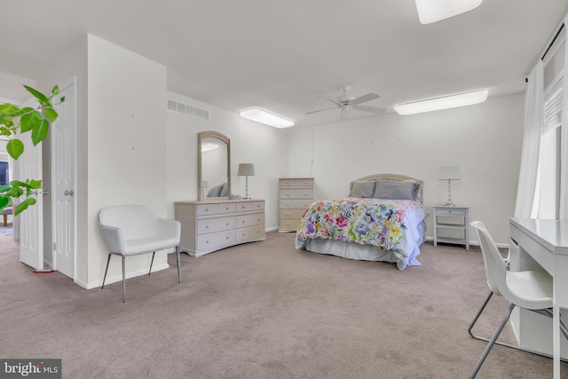 bedroom with ceiling fan and light carpet