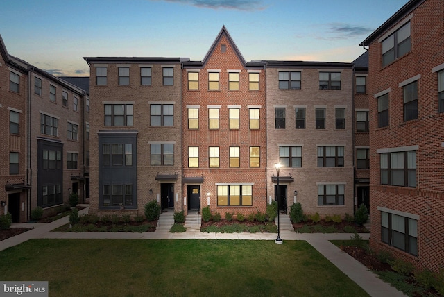 view of outdoor building at dusk