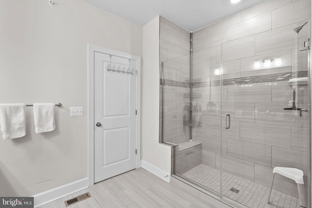 bathroom featuring an enclosed shower