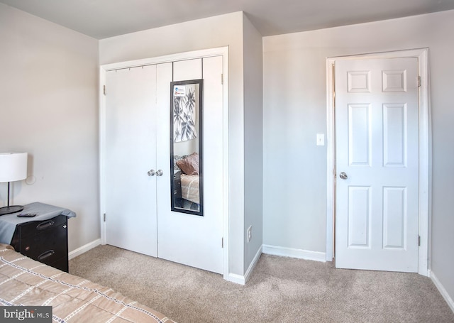 unfurnished bedroom with a closet and carpet