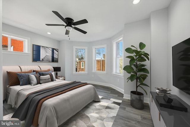 bedroom featuring hardwood / wood-style flooring and ceiling fan