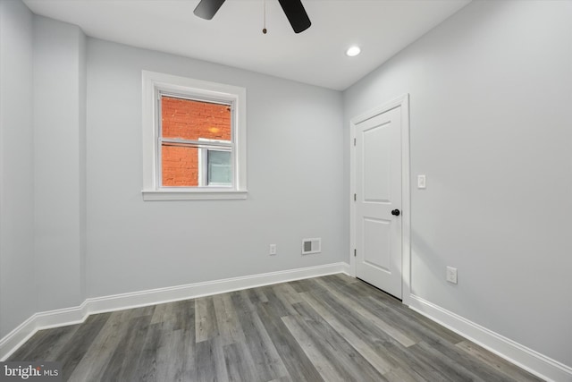 spare room featuring ceiling fan and wood-type flooring