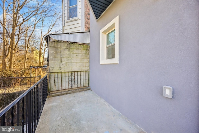 view of side of property with a balcony