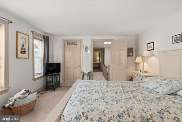 bedroom with light carpet