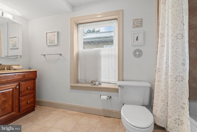 bathroom with a shower with shower curtain, tile patterned floors, vanity, and toilet