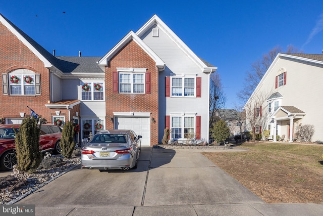 view of front of home featuring a garage and a front lawn