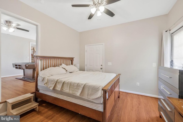 bedroom with ceiling fan and light hardwood / wood-style floors