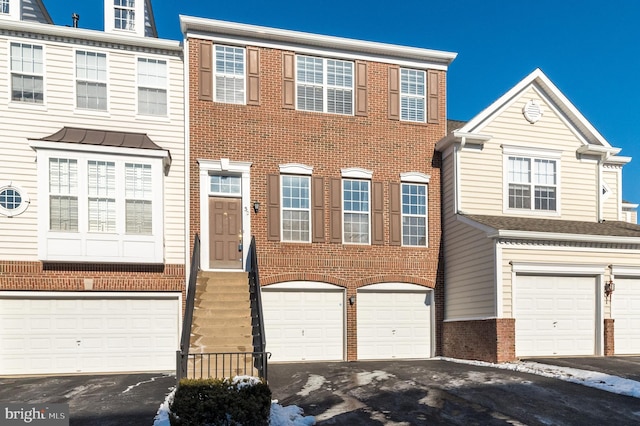 townhome / multi-family property featuring a garage