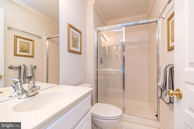 bathroom with tile patterned flooring, ornamental molding, a shower with shower door, and toilet