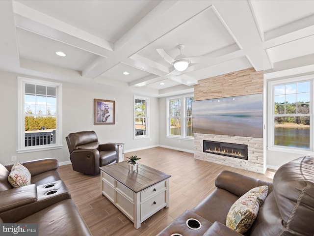 living room with coffered ceiling, baseboards, and wood finished floors