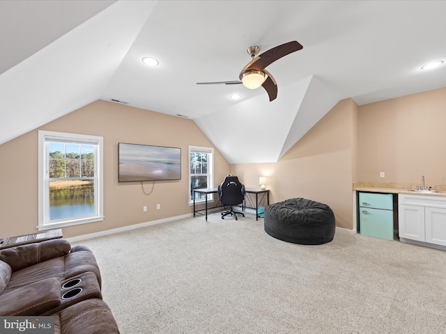 living area with carpet floors, indoor wet bar, lofted ceiling, a wealth of natural light, and visible vents