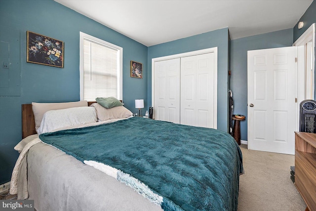 carpeted bedroom featuring a closet