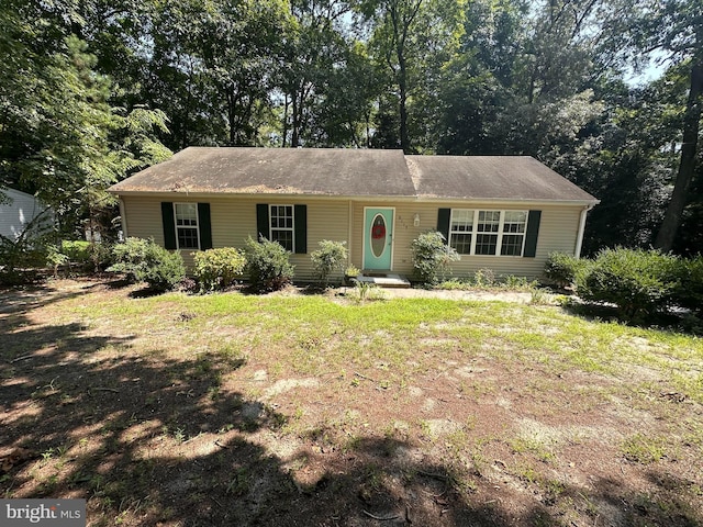 ranch-style house with a front lawn