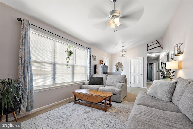 living room with light colored carpet, lofted ceiling, and plenty of natural light